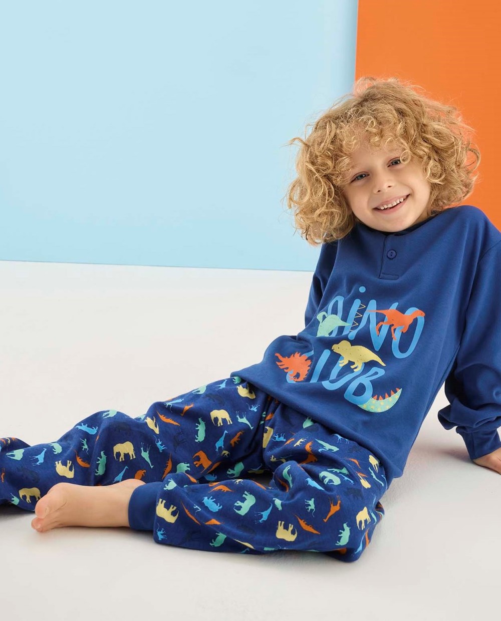 Modré pyžamo pro kluky na knoflíky s dinosaury